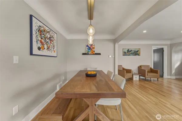 a view of a dining room with furniture and wooden floor