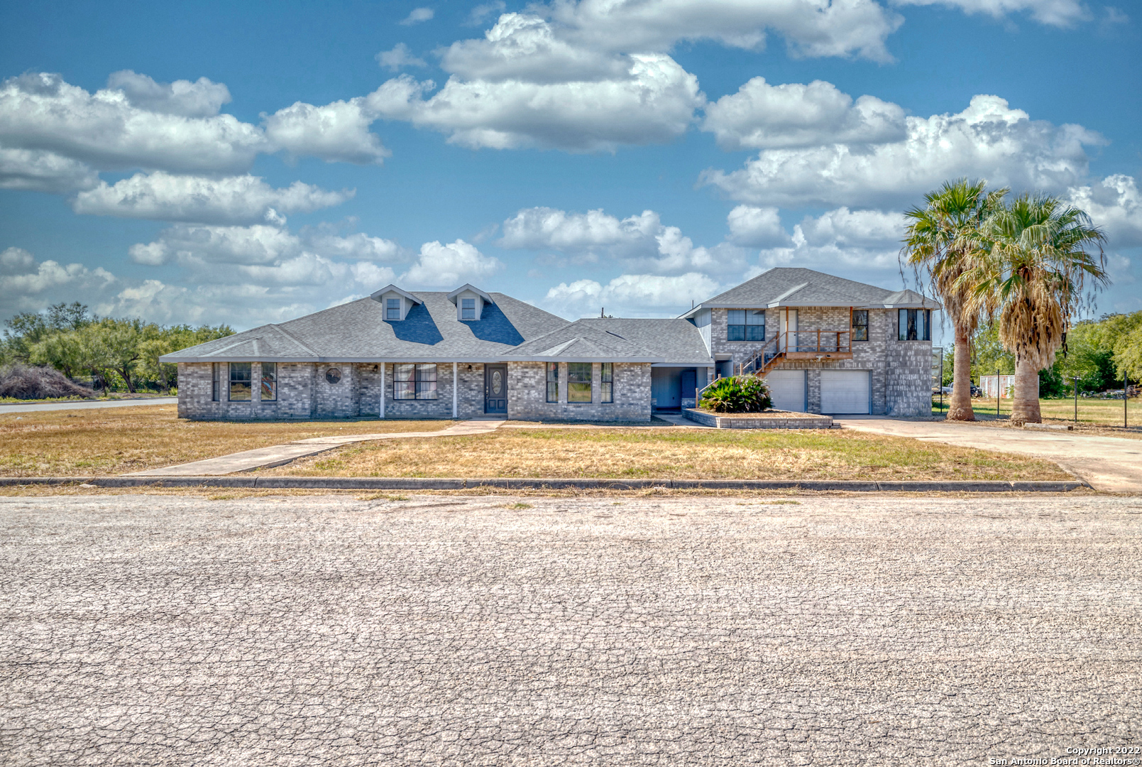 a view of a house with a big yard
