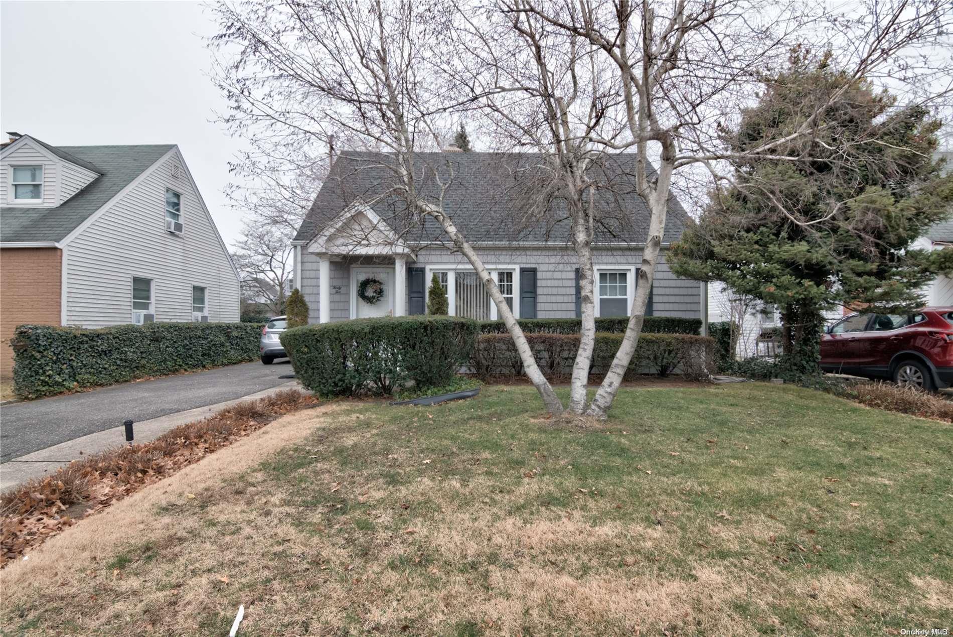 42 Horton Road Valley Stream, NY 11581 - Photo 1 of 1 front view of a house with a yard