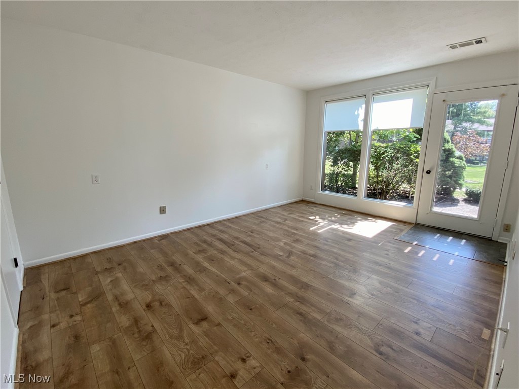 985 Canyon View Road, Unit 102B Northfield, OH 44067 - Photo 11 of 32 Bedroom with laminate wood-type flooring