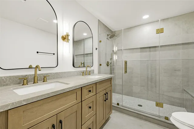 a bathroom with a shower and a toilet