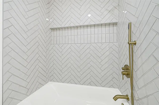 a front view of a house with a garden and yard