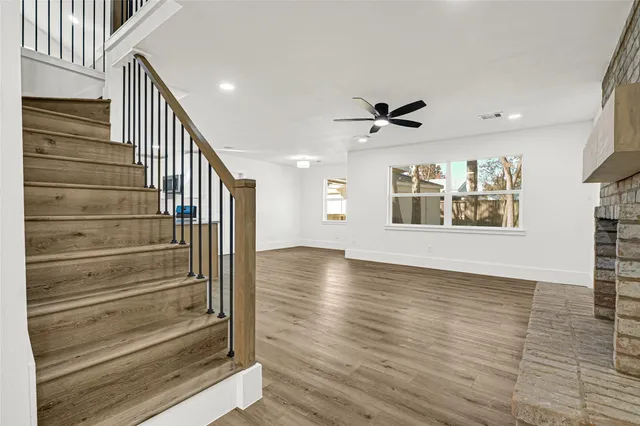 a view of an entryway with wooden floor