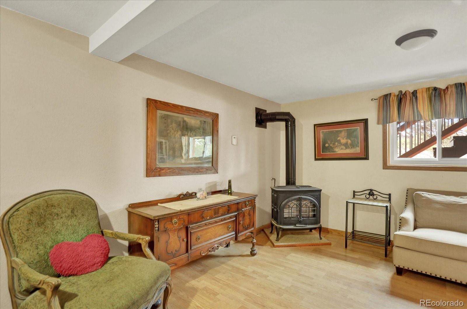 249 Burland Drive Bailey, CO 80421 - Photo 17 of 34 a living room with furniture and a couch