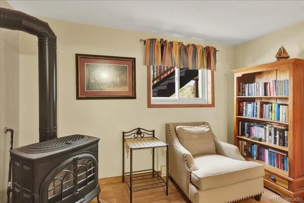 a view of a livingroom with furniture and staircase