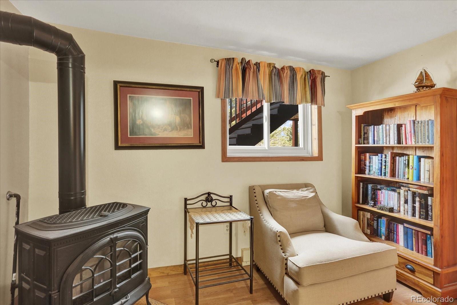 249 Burland Drive Bailey, CO 80421 - Photo 18 of 34 a view of a livingroom with furniture and staircase