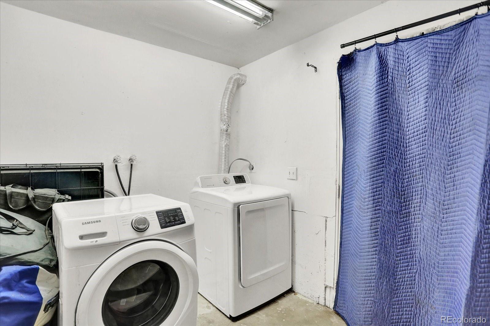 249 Burland Drive Bailey, CO 80421 - Photo 22 of 34 a utility room with dryer and washer