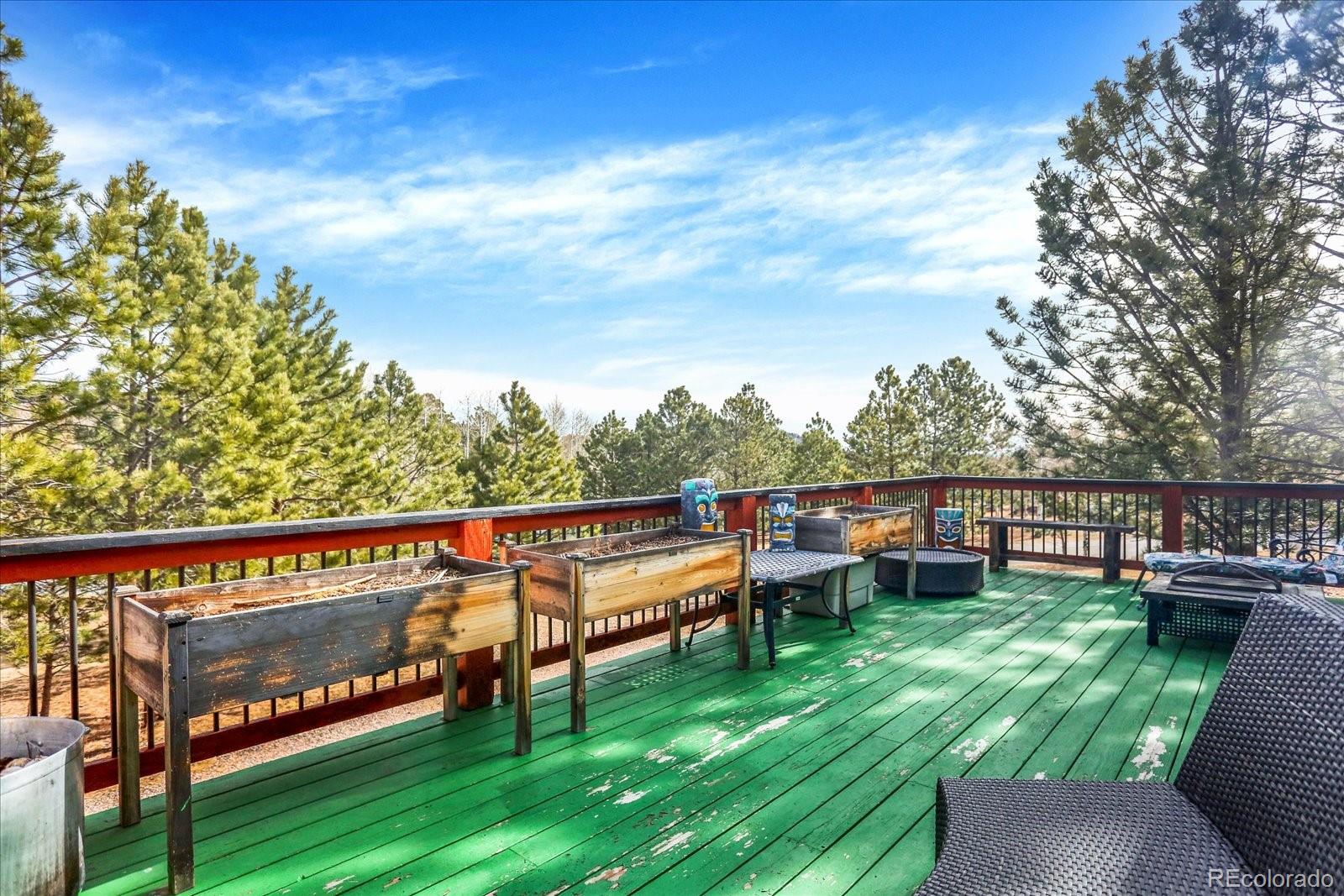 249 Burland Drive Bailey, CO 80421 - Photo 25 of 34 a view of a chairs in a deck