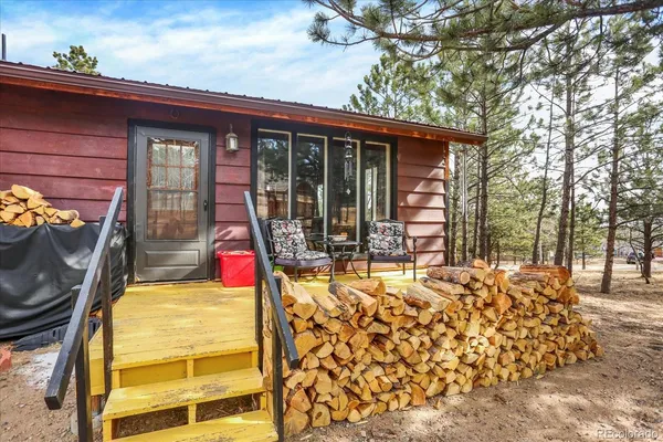 a front view of house with outdoor seating