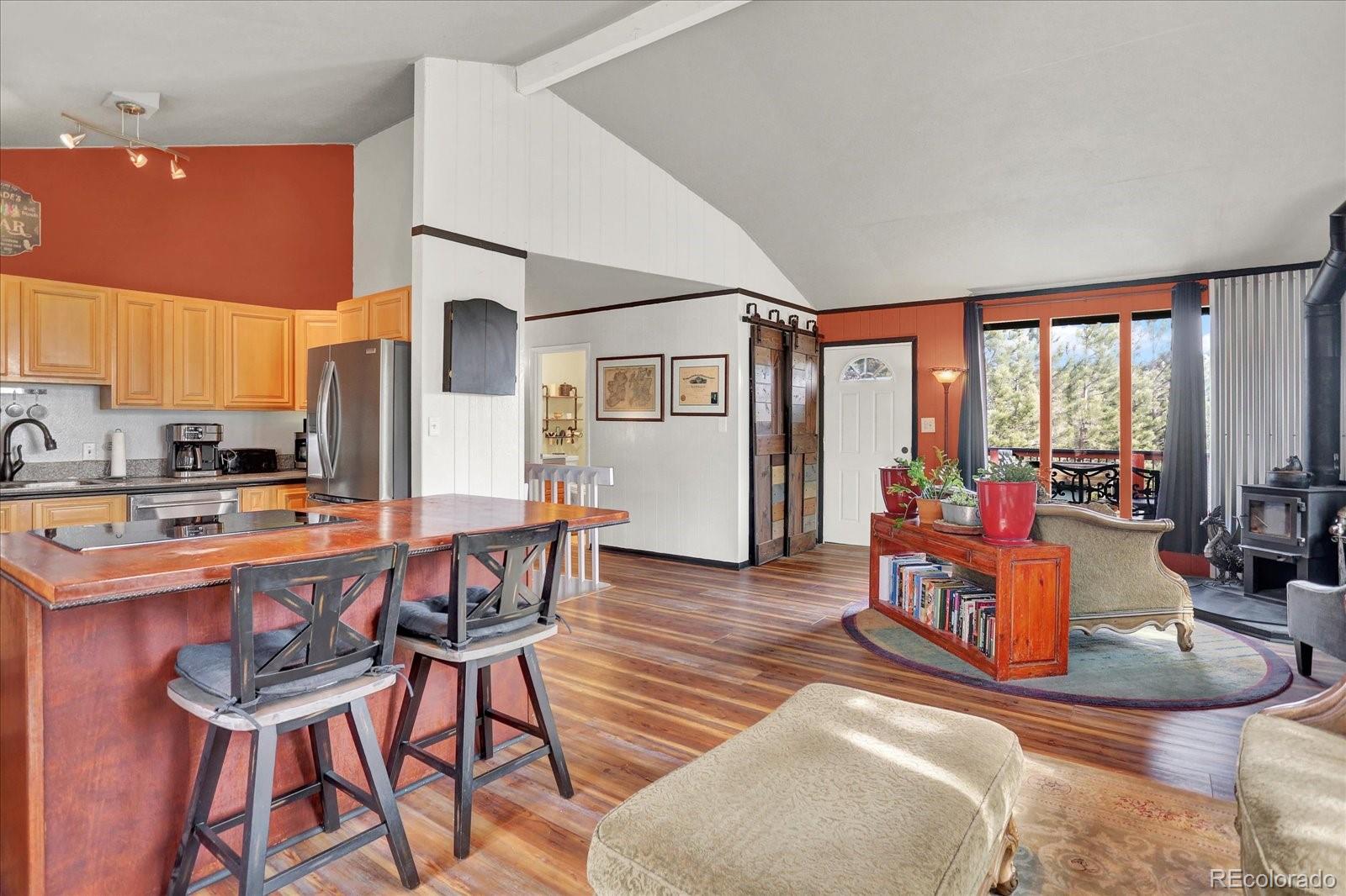 249 Burland Drive Bailey, CO 80421 - Photo 4 of 34 a view of a dining room with furniture window and outside view