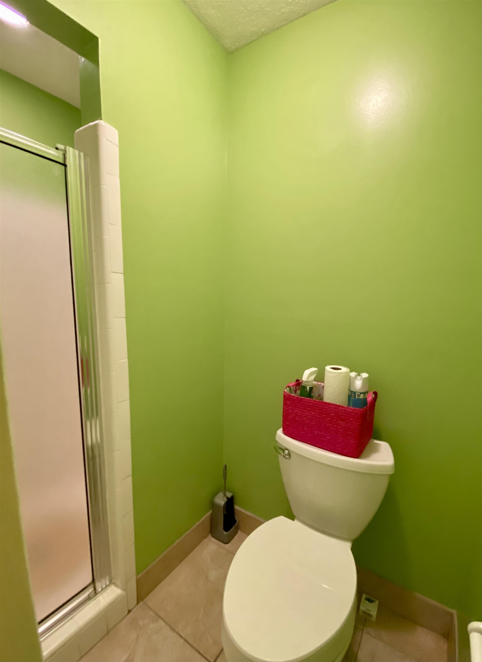 1235 Creeks Edge Cove Memphis, TN 38016 - Photo 14 of 15 Full bathroom featuring a shower stall, tile patterned flooring, and a textured ceiling