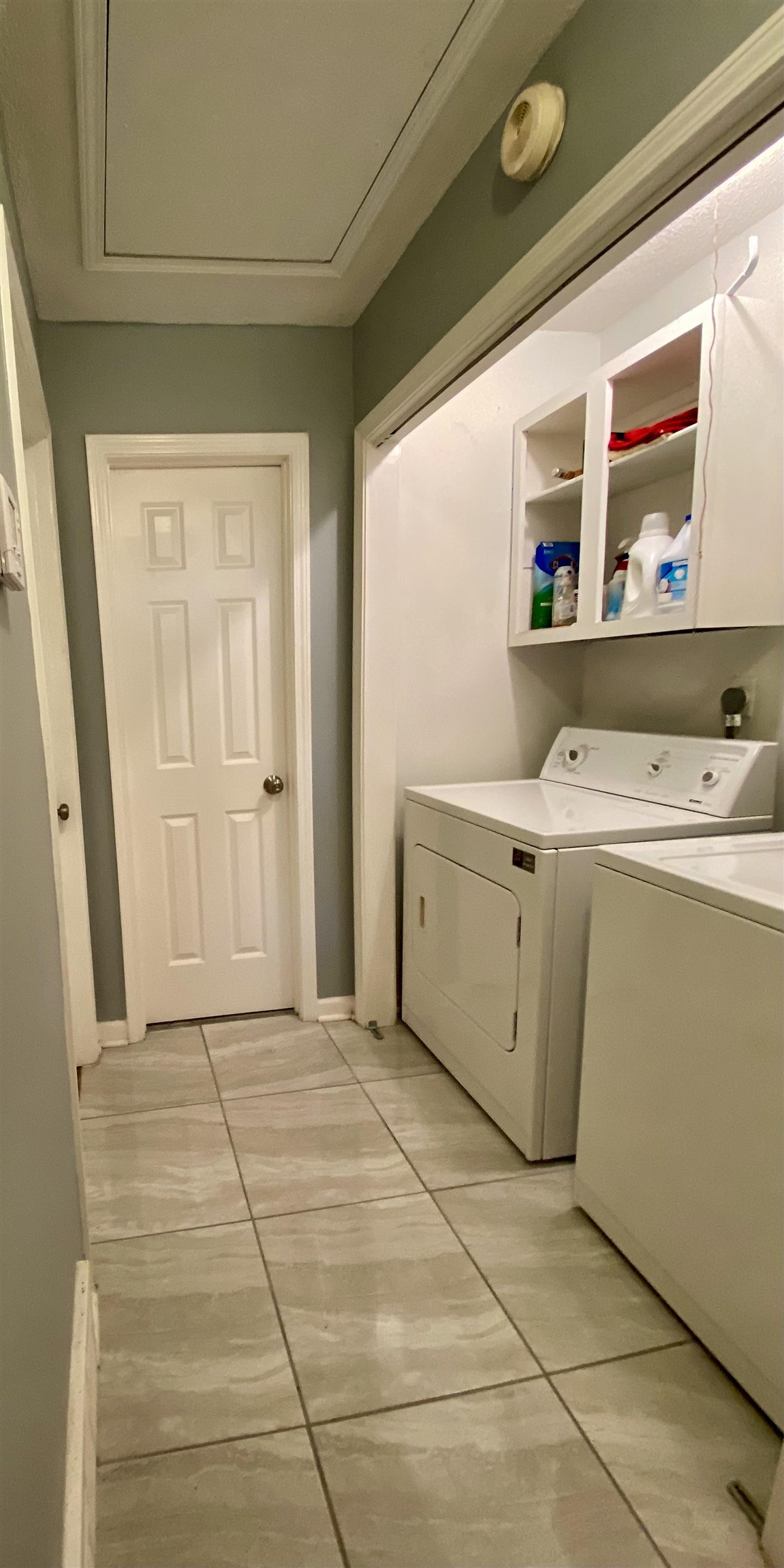 1235 Creeks Edge Cove Memphis, TN 38016 - Photo 3 of 15 Laundry Closet off front entrance hall with washer & dryer connections and light tile patterned floors