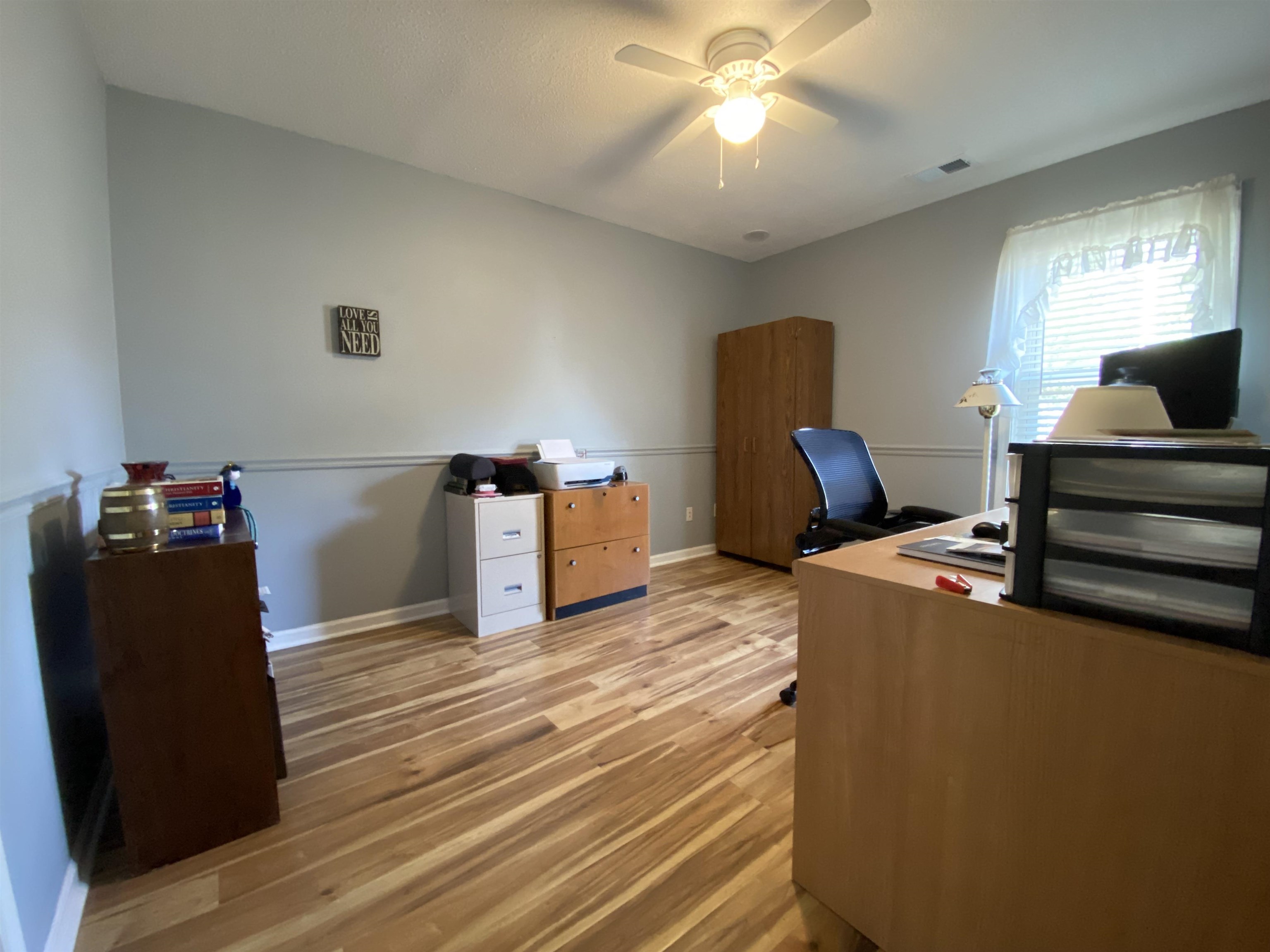 1235 Creeks Edge Cove Memphis, TN 38016 - Photo 7 of 15 Bedroom turned home office featuring light wood finished floors and a ceiling fan