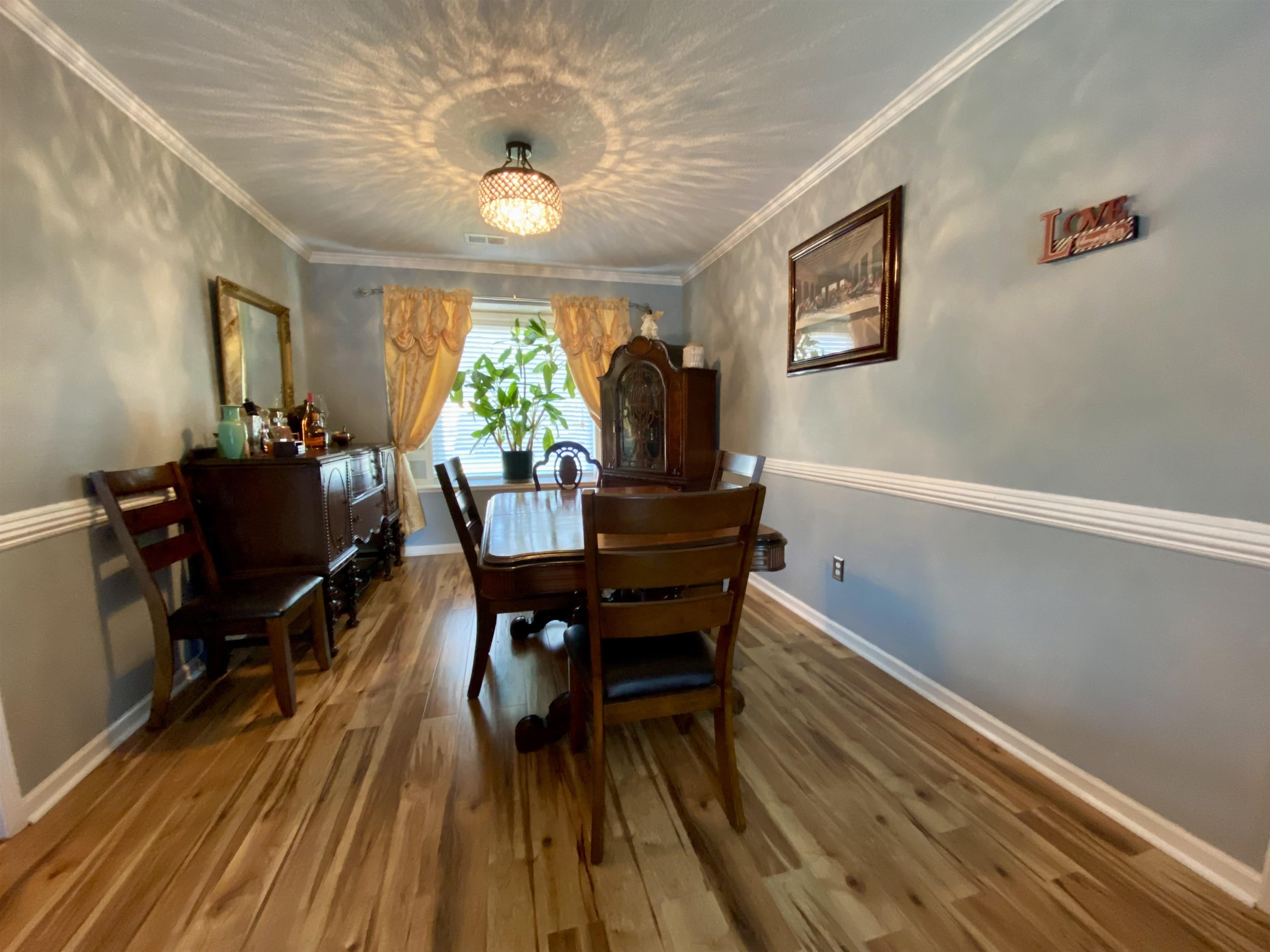 1235 Creeks Edge Cove Memphis, TN 38016 - Photo 10 of 15 Dining area with crown molding and wood finished floors