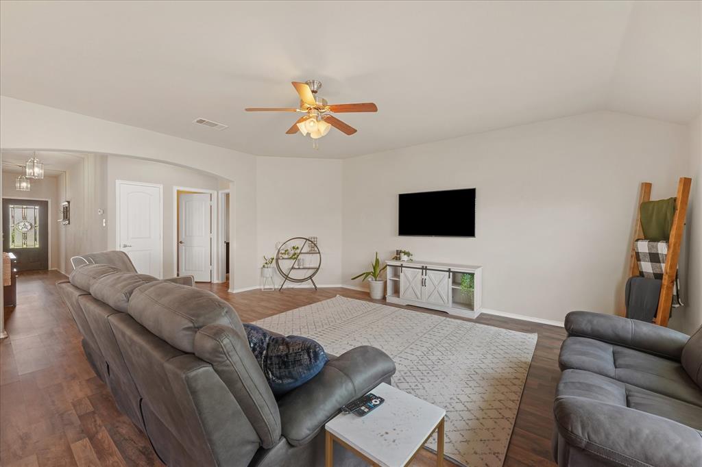 409 Harding Lane Lavon, TX 75166 - Photo 18 of 34 Vaulted ceiling with a ceiling fan, recessed lighting, and wood-finish flooring