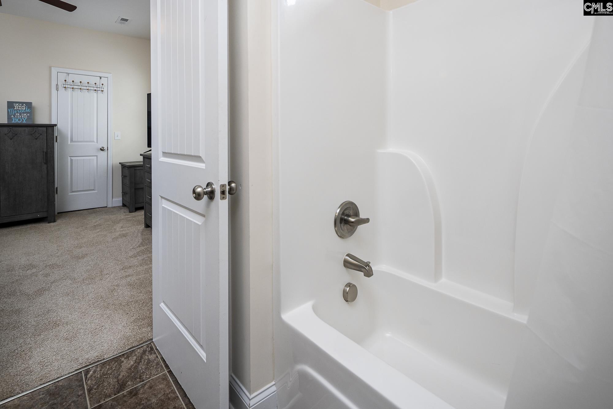 213 Sunset Point Drive Lexington, SC 29072 - Photo 28 of 35 a bathroom with a tub and sink
