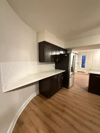 a kitchen with stainless steel appliances a sink and a microwave