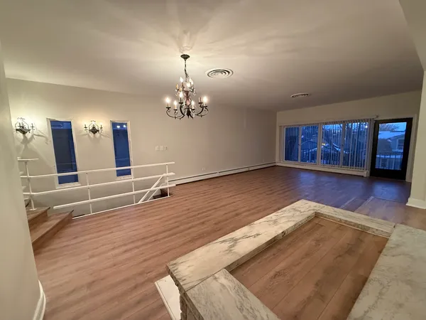 a bathroom with a toilet a sink and shower