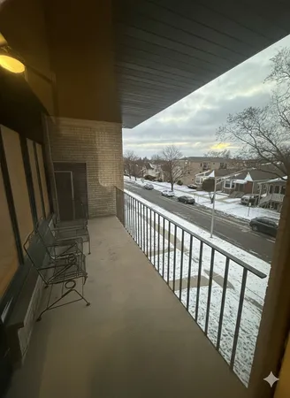 a view of balcony with furniture