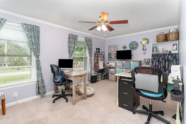 a view of a workspace with furniture