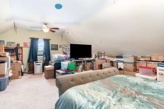 a bedroom with a bed and a closet