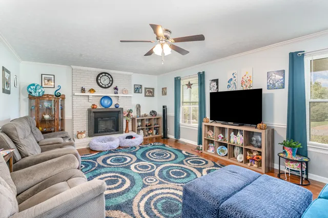 a living room with furniture and a flat screen tv