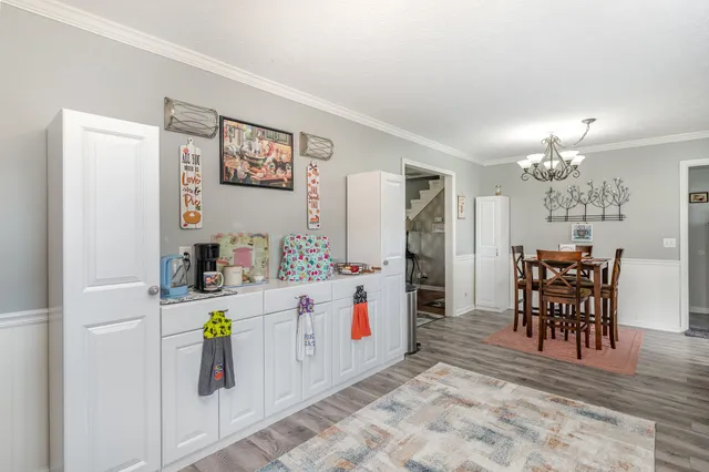 a kitchen with stainless steel appliances kitchen island granite countertop a sink and cabinets