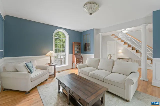 a kitchen with granite countertop white cabinets and stainless steel appliances