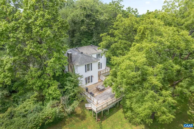 a aerial view of a house with a yard