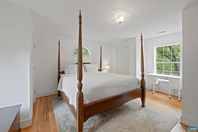 a bathroom with a sink a light fixture and a mirror