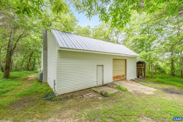 a house view with a sitting space and garden