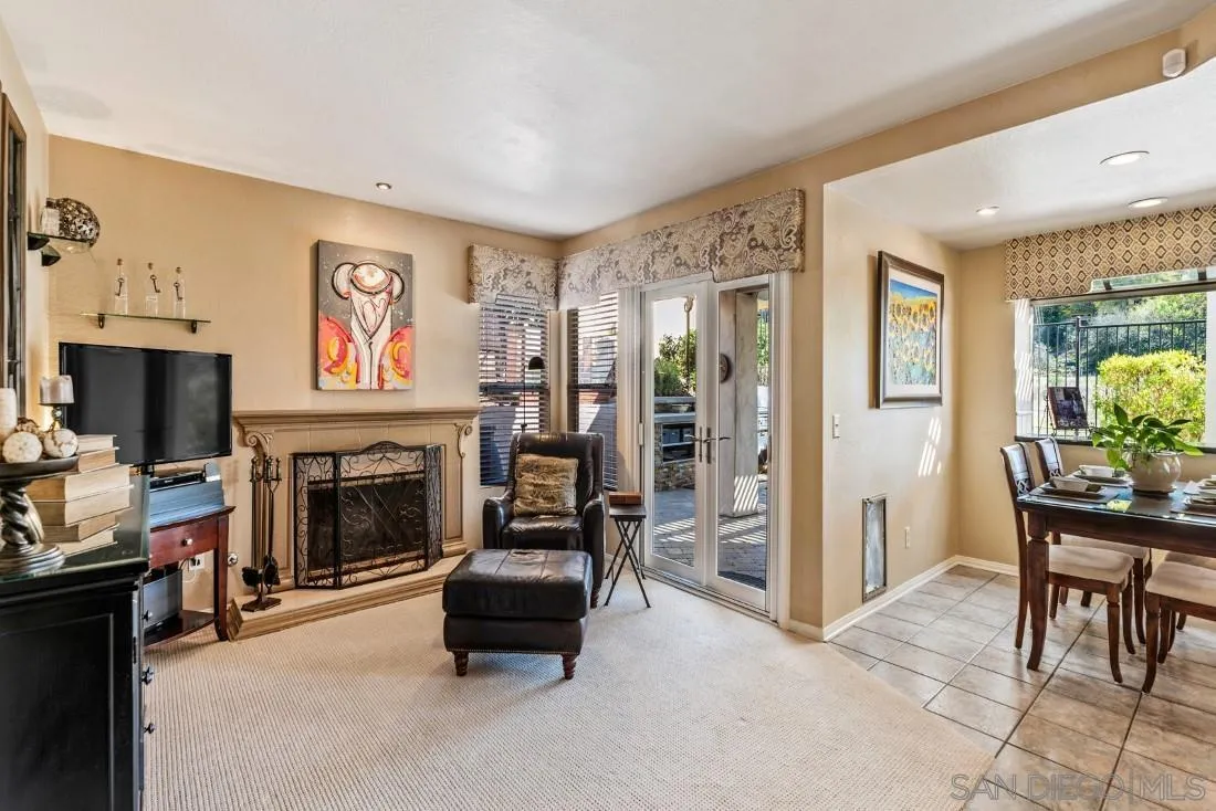 13755 Royal Melbourne Square San Diego, CA 92128 - Photo 18 of 75 a living room with furniture and a fireplace