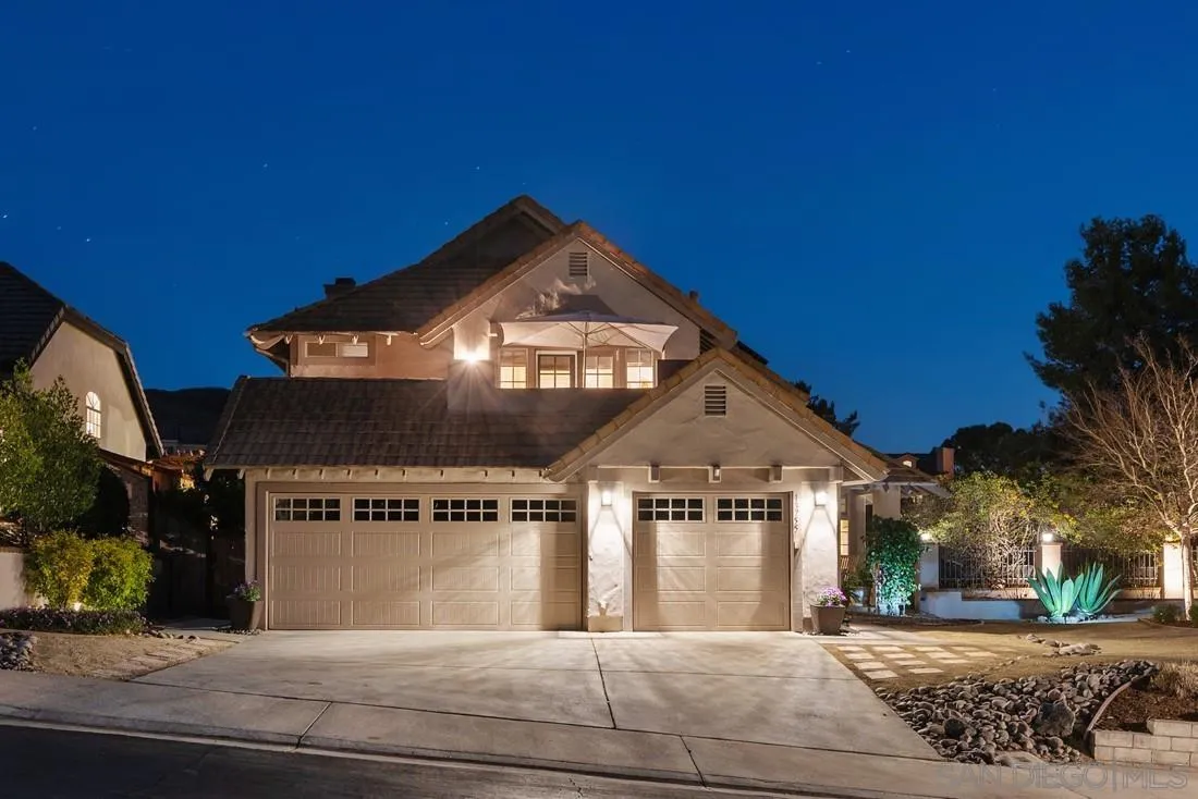 13755 Royal Melbourne Square San Diego, CA 92128 - Photo 2 of 75 a front view of a house with a yard