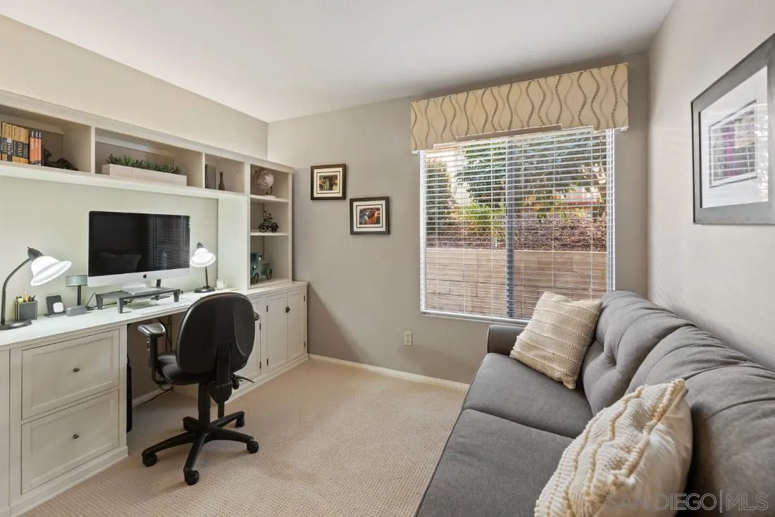 13755 Royal Melbourne Square San Diego, CA 92128 - Photo 40 of 75 a view of a livingroom with workspace and a window