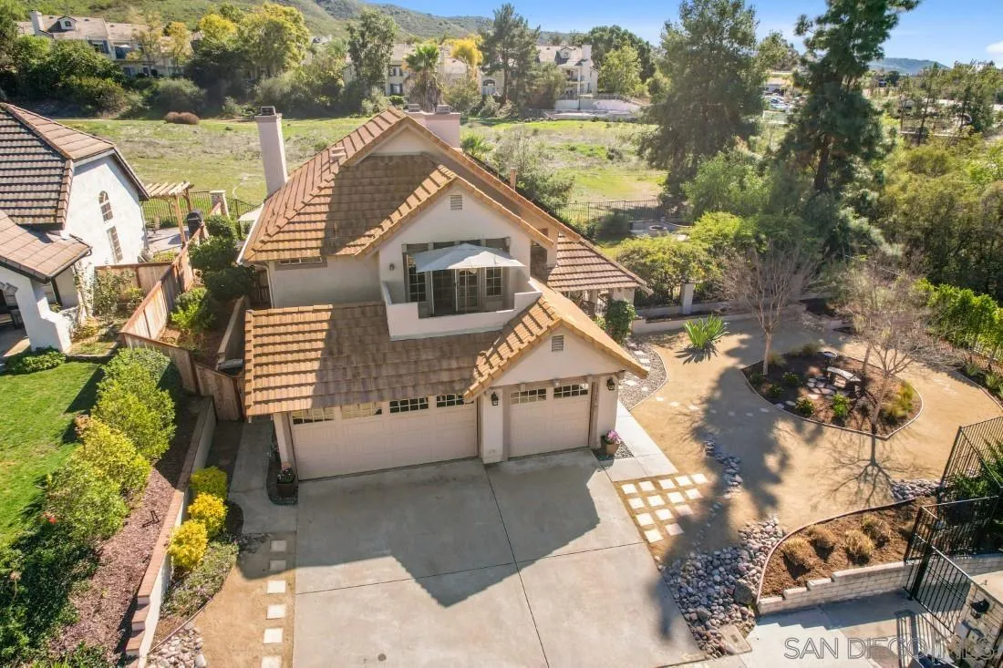 13755 Royal Melbourne Square San Diego, CA 92128 - Photo 4 of 75 a view of house with a yard