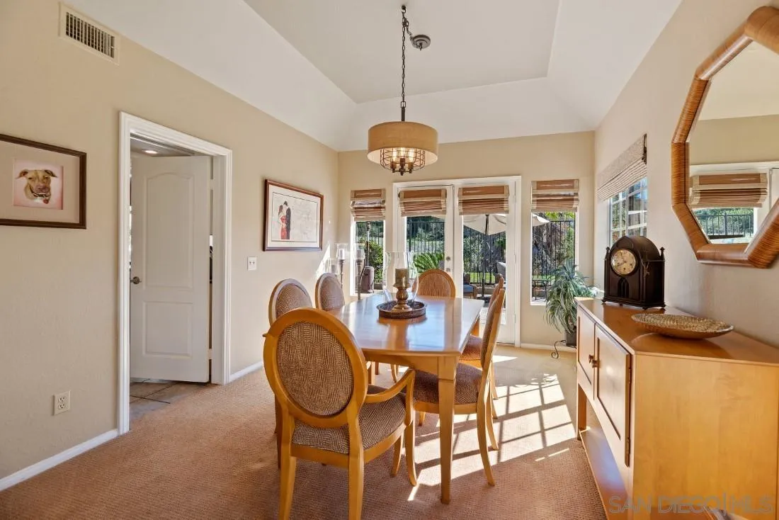 13755 Royal Melbourne Square San Diego, CA 92128 - Photo 43 of 75 a dining room with livingroom view and wooden floor