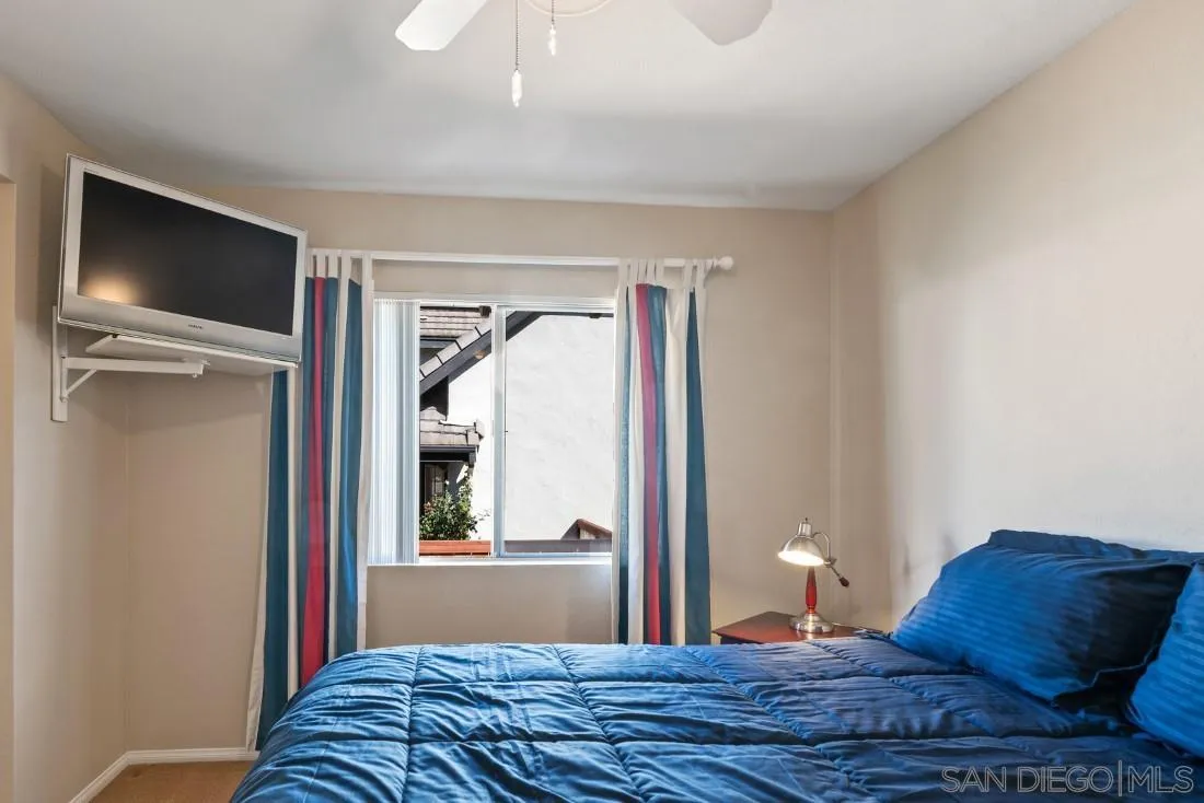13755 Royal Melbourne Square San Diego, CA 92128 - Photo 55 of 75 a bedroom with a bed and a window