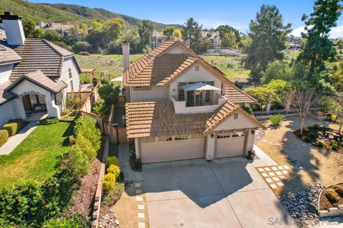 13755 Royal Melbourne Square San Diego, CA 92128 - Photo 65 of 75 a front view of a house with a yard