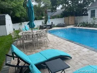 a view of an outdoor sitting area with furniture and wooden floor