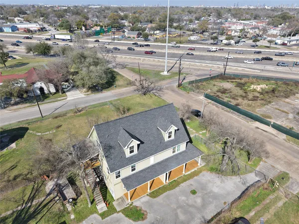 an aerial view of a house with a swimming pool