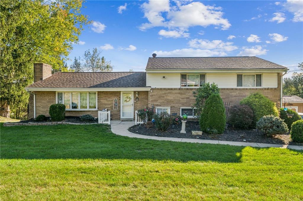 228 Ridgeview Drive Venetia, PA 15367 - Photo 36 of 37 a front view of a house with a yard and garage