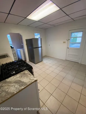 a kitchen with stainless steel appliances granite countertop a sink and a stove