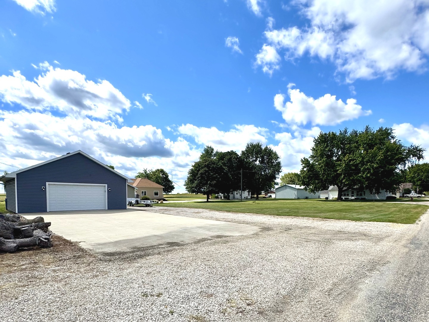 a view of a house with a yard and garage