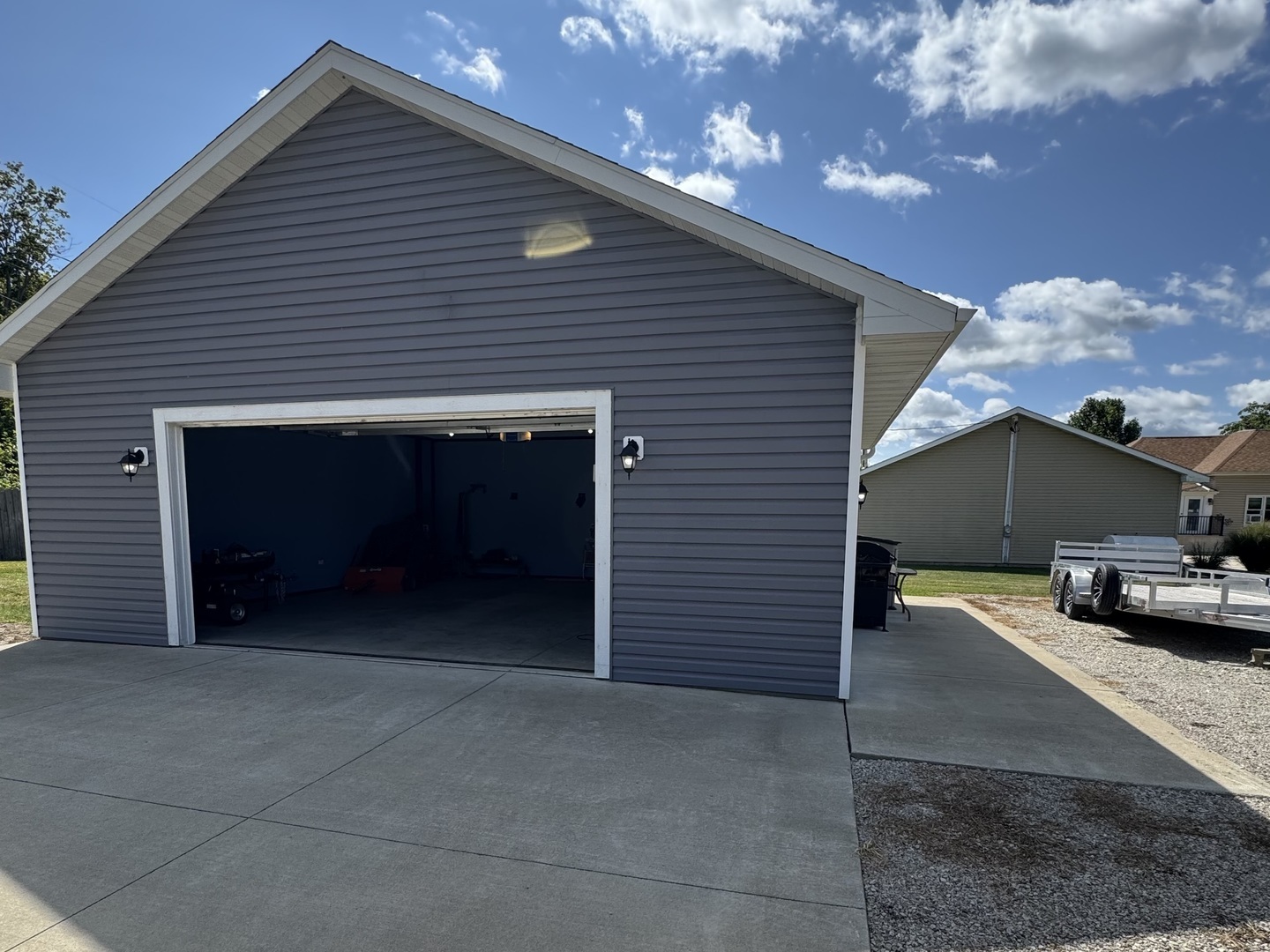 302 East Harrison Street Ransom, IL 60470 - Photo 11 of 19 a view of a house with a yard and garage