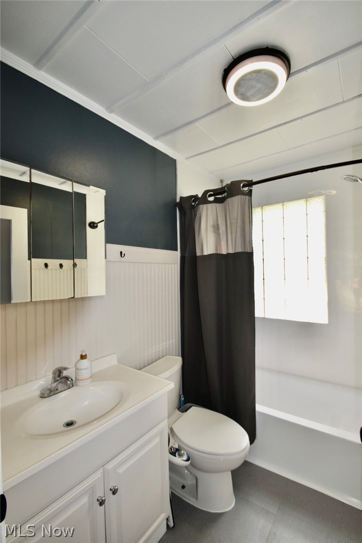 1053 Novak Road Grafton, OH 44044 - Photo 11 of 20 Full bathroom with tile flooring, toilet, oversized vanity, and shower / bath combo