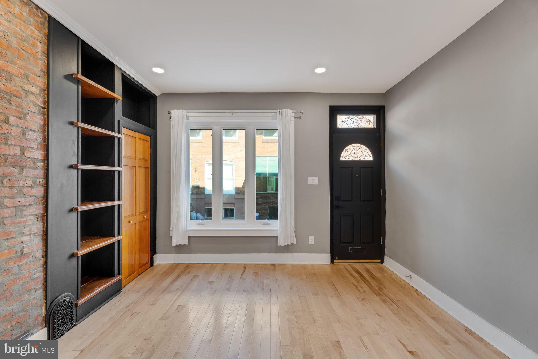 1838 Tree Street Philadelphia, PA 19145 - Photo 3 of 29 Living room with built-in shelving and coat closet
