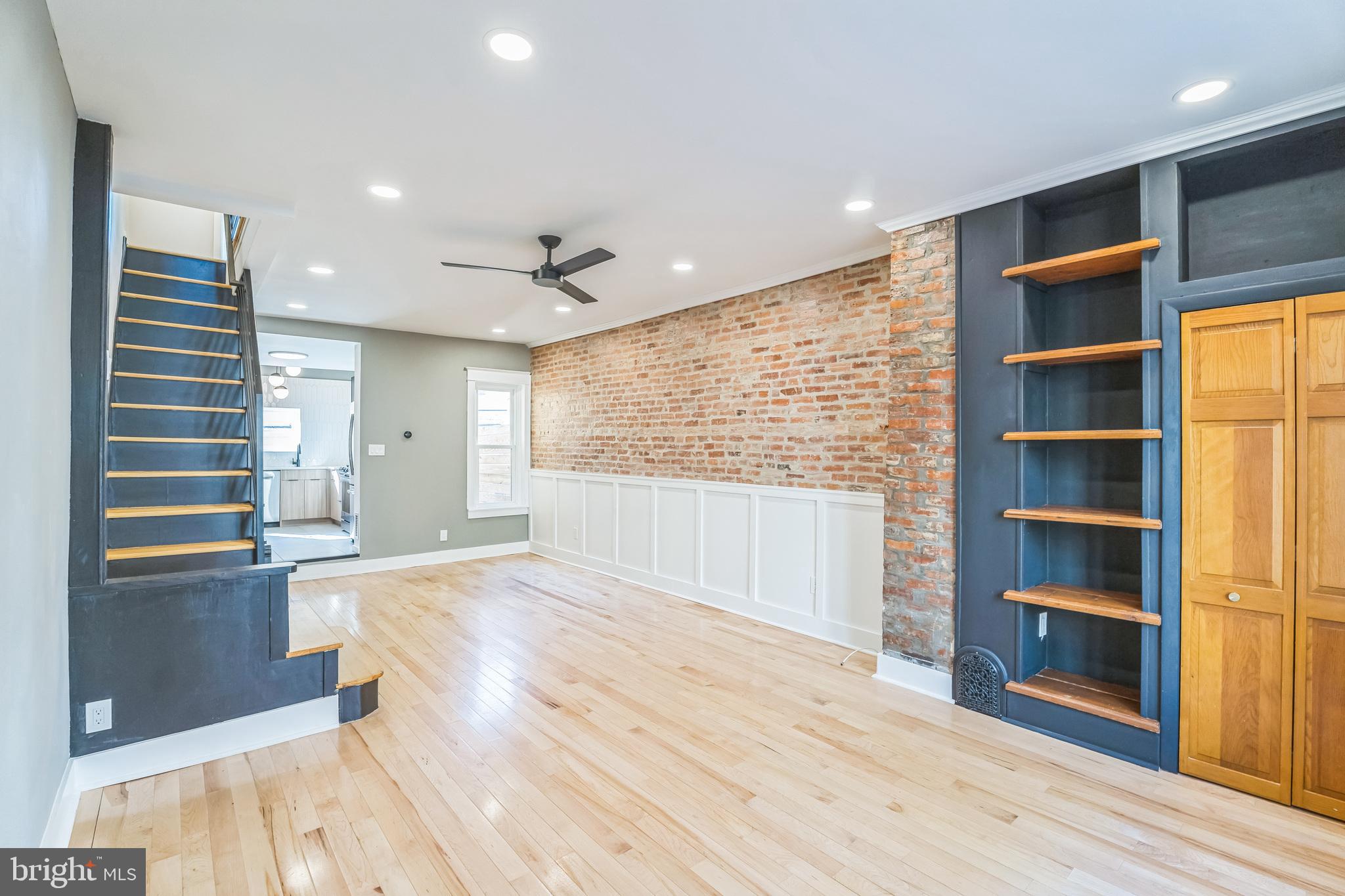 1838 Tree Street Philadelphia, PA 19145 - Photo 4 of 29 Living room open to dining area with exposed brick
