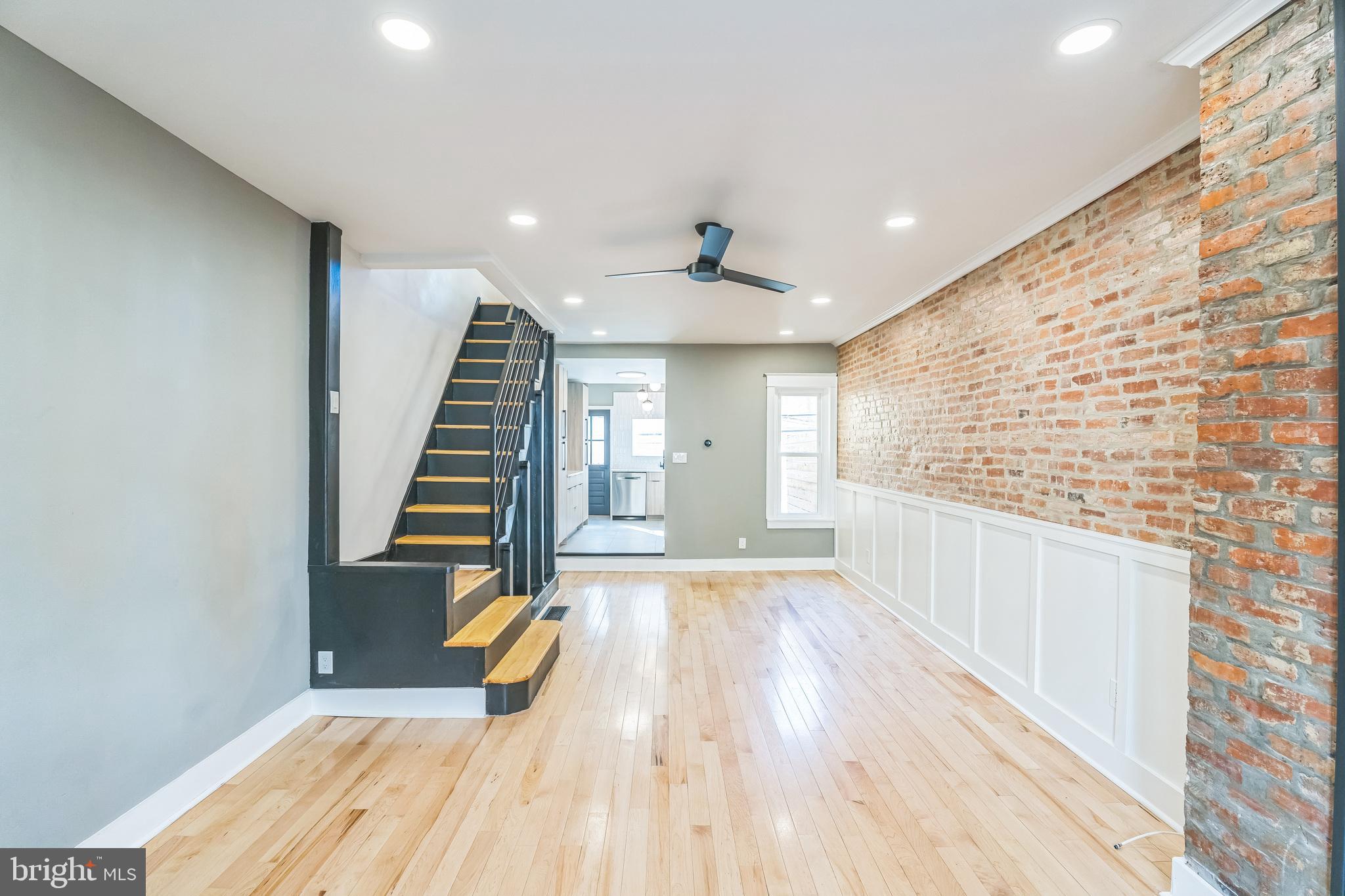 1838 Tree Street Philadelphia, PA 19145 - Photo 5 of 29 Living room open to dining area with exposed brick
