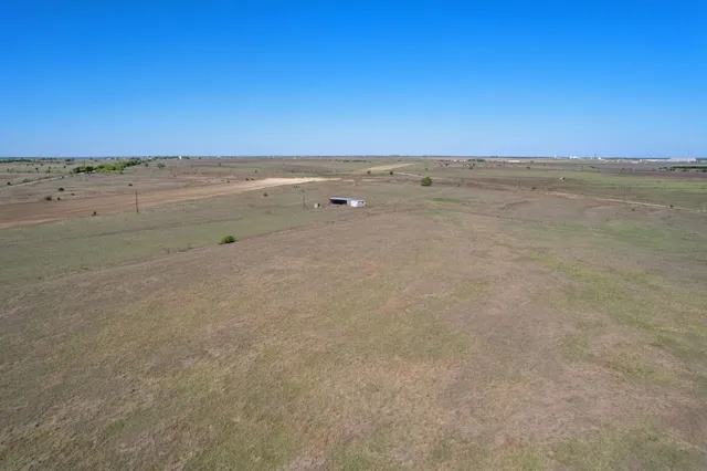 a view of house with backyard