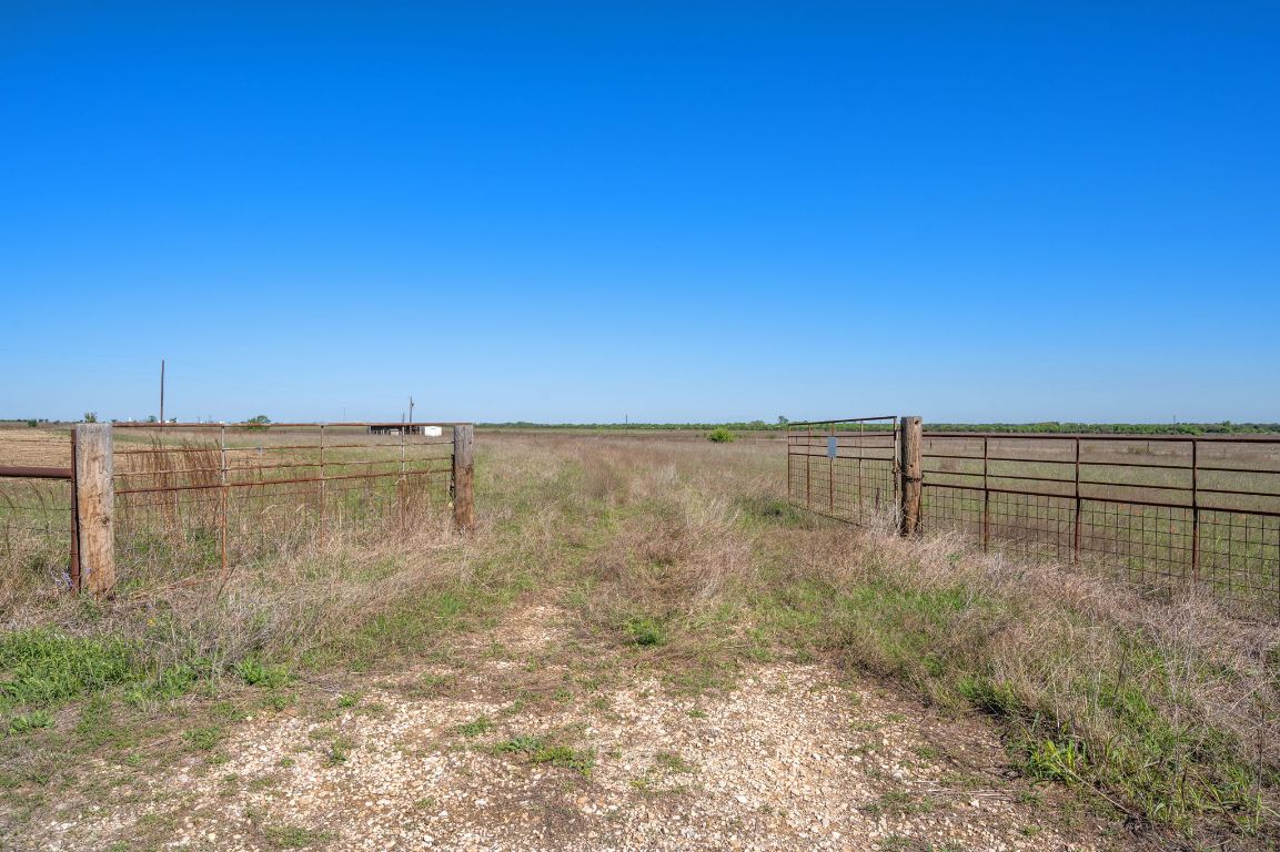 211 County Road 211 Bertram, TX 78605 - Photo 24 of 27 a view of a dry yard with wooden fence